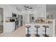 Modern kitchen featuring white cabinets, stainless steel appliances, and a breakfast bar at 19204 Paddock St, Orlando, FL 32833