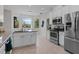 Bright kitchen with white cabinets, granite counters, and stainless steel appliances at 19204 Paddock St, Orlando, FL 32833