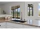 Kitchen featuring granite countertops, stainless steel faucet, and a view of the backyard at 19204 Paddock St, Orlando, FL 32833