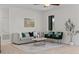 Bright living room featuring neutral walls, stylish decor, and a cozy seating arrangement at 19204 Paddock St, Orlando, FL 32833