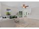 Open-concept living room with stylish decor, plush seating, tile flooring, and plenty of natural light at 19204 Paddock St, Orlando, FL 32833