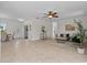 Open concept living room with tile floors, neutral decor, and natural light from multiple windows at 19204 Paddock St, Orlando, FL 32833