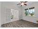 Bright living room with wood floors, and glass paneled doors leading to the dining area at 19204 Paddock St, Orlando, FL 32833