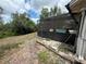 A view of the backyard showcasing the screened-in lanai and swimming pool, perfect for outdoor relaxation at 2120 Lakebreeze Way, Deltona, FL 32738