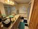 Bright bathroom with an extended vanity and decorative mirror at 2120 Lakebreeze Way, Deltona, FL 32738