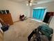 Spacious bedroom featuring a ceiling fan and bright window at 2120 Lakebreeze Way, Deltona, FL 32738