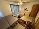 Comfortable bedroom with a full sized bed, sofa and ceiling fan at 2120 Lakebreeze Way, Deltona, FL 32738