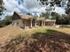 Charming single-story home with brick accents, columns, and a well-maintained lawn at 2120 Lakebreeze Way, Deltona, FL 32738