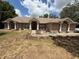 Charming single-story brick house with a well-manicured front yard, columns, and a welcoming entrance at 2120 Lakebreeze Way, Deltona, FL 32738