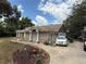 Charming single-story brick home featuring mature landscaping and a side-entry garage at 2120 Lakebreeze Way, Deltona, FL 32738