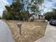 Residential house with a mailbox, driveway, and a well-maintained front yard with mature trees at 2120 Lakebreeze Way, Deltona, FL 32738