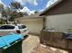 Attached two car garage with a white door and a parked car on the driveway at 2120 Lakebreeze Way, Deltona, FL 32738