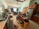 Kitchen area with tiled floor and stainless refrigerator at 2120 Lakebreeze Way, Deltona, FL 32738