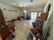 Spacious living room with lots of light, laminate flooring and sliding glass doors to pool at 2120 Lakebreeze Way, Deltona, FL 32738