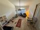 High ceiling living room with laminate flooring and window at 2120 Lakebreeze Way, Deltona, FL 32738