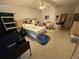 Spacious carpeted main bedroom features ceiling fan and built-in shelves at 2120 Lakebreeze Way, Deltona, FL 32738