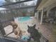 A playful pool scene featuring two dogs enthusiastically enjoying the water at 2120 Lakebreeze Way, Deltona, FL 32738