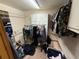 Walk-in closet with clothing racks, storage cabinets, and ample space for organizing clothes and personal items at 2120 Lakebreeze Way, Deltona, FL 32738