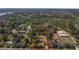 Prime land parcel outlined in red with lush tree coverage, strategically located near shopping and housing areas at 2214 Rouse Rd, Orlando, FL 32817