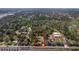 An aerial view of the outlined land, featuring lush, mature tree coverage and convenient access to roads at 2214 Rouse Rd, Orlando, FL 32817