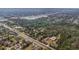 An aerial shot capturing property surrounded by roads, trees, commercial, and residential zoning at 2214 Rouse Rd, Orlando, FL 32817