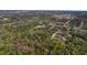 Scenic aerial shot showcases lush land, local neighborhoods, and serene bodies of water at 2214 Rouse Rd, Orlando, FL 32817
