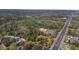 An aerial perspective that features land and a neighborhood bordering a well-traveled highway at 2214 Rouse Rd, Orlando, FL 32817