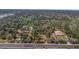 An aerial shot showcases land, nearby local businesses, and surrounding roads at 2214 Rouse Rd, Orlando, FL 32817