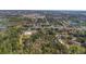 An aerial view shows sprawling land and nearby community amenities, like sports fields and ponds at 2214 Rouse Rd, Orlando, FL 32817