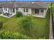 Backyard featuring a well-maintained lawn and a cozy outdoor seating area perfect for relaxing at 2241 Mystic Maze Ln, Minneola, FL 34715