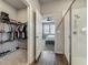 Bathroom featuring glass-enclosed shower, walk-in closet with open door and bedroom view in the distance at 2241 Mystic Maze Ln, Minneola, FL 34715
