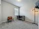 Bedroom featuring neutral walls, plush carpet, a desk, a brown chair and modern lamp at 2241 Mystic Maze Ln, Minneola, FL 34715