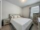 Bedroom with neutral walls, wood-look furniture, plush carpet, a window, and natural light at 2241 Mystic Maze Ln, Minneola, FL 34715