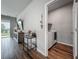 Hallway with laundry room in view, including side-by-side washer and dryer at 2241 Mystic Maze Ln, Minneola, FL 34715
