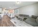 Spacious living room and kitchen with modern finishes and an open concept layout, perfect for entertaining at 2241 Mystic Maze Ln, Minneola, FL 34715