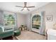 Cozy bedroom with natural light, colorful rug, and serene view of the lake creating a peaceful retreat at 2415 S Oak Ave, Sanford, FL 32771