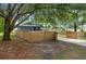 Beautiful home showcasing mature trees and a fenced yard, offering a serene and private setting at 2415 S Oak Ave, Sanford, FL 32771