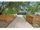 Charming home featuring a long driveway and gated wooden fence offering privacy and curb appeal at 2415 S Oak Ave, Sanford, FL 32771