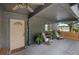 Welcoming front porch with comfortable rocking chairs, a ceiling fan, and a glimpse of the serene lake view at 2415 S Oak Ave, Sanford, FL 32771