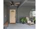Charming covered porch with ceiling fan, rocking chairs, and an arched window creating a cozy entryway at 2415 S Oak Ave, Sanford, FL 32771