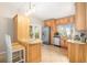 Spacious kitchen with stainless steel appliances, granite countertops, and convenient breakfast bar seating at 2415 S Oak Ave, Sanford, FL 32771