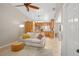 Open-concept living room offers a comfortable seating area adjacent to a bright, well-equipped kitchen at 2415 S Oak Ave, Sanford, FL 32771