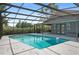 A large pool with a screen enclosure offers a relaxing and private outdoor space at 2415 S Oak Ave, Sanford, FL 32771