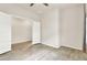Bright bedroom with a ceiling fan, neutral walls, and wood-look floors, featuring an open doorway at 2458 Cliff Way, St Cloud, FL 34771