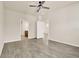 Bright bedroom with a ceiling fan and wood-look floors at 2458 Cliff Way, St Cloud, FL 34771