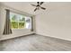 Bedroom with a ceiling fan, natural light, and wood-look floors at 2458 Cliff Way, St Cloud, FL 34771
