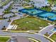 Aerial view of the community dog park and parking area, perfect for furry friends to play and socialize at 2458 Cliff Way, St Cloud, FL 34771