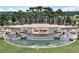 Aerial view of Del Webb Sunbridge community entrance with water features and lush landscaping at 2458 Cliff Way, St Cloud, FL 34771