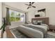 Calm main bedroom with a large window, modern decor, and a comfortable king-size bed at 2458 Cliff Way, St Cloud, FL 34771