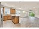 Open kitchen and living room with recessed lighting and a sliding glass door at 2458 Cliff Way, St Cloud, FL 34771